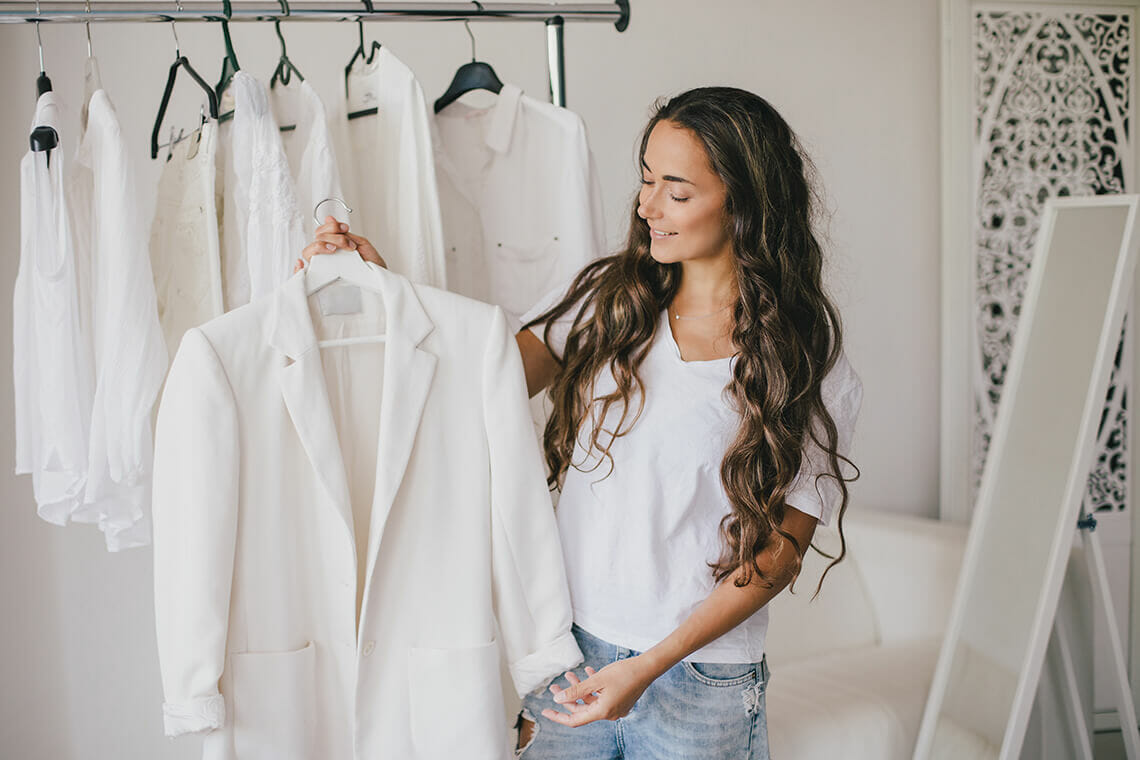 Woman holding a white jacket