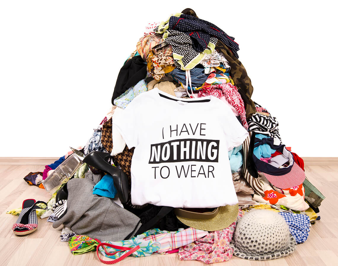 pile of clothes with a t-shirt saying 'I have nothing to wear'