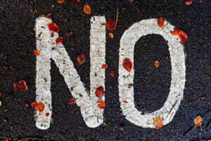an image of 'no' written on the road