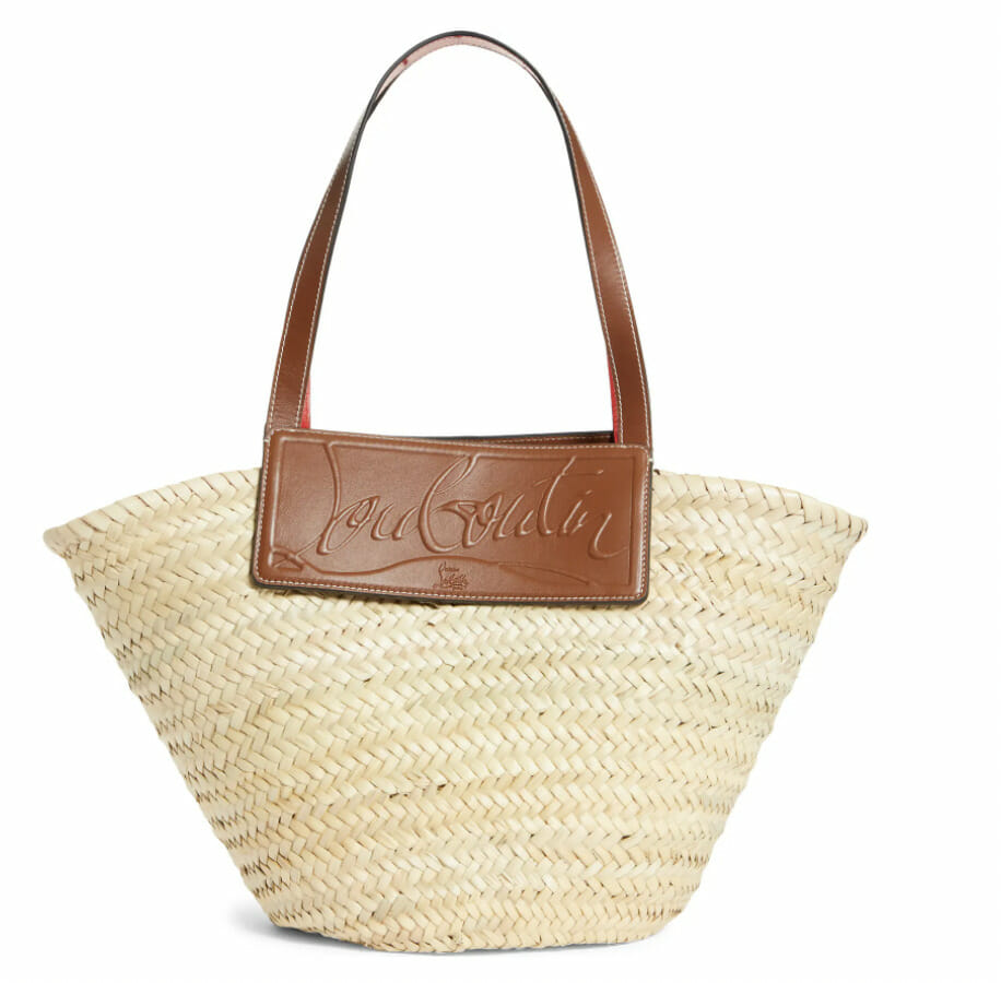 a straw and cognac leather tote beach bag