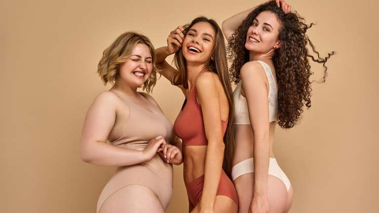 Three happy women of different body types