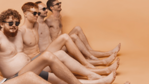 several men sitting down of differnt body shapes